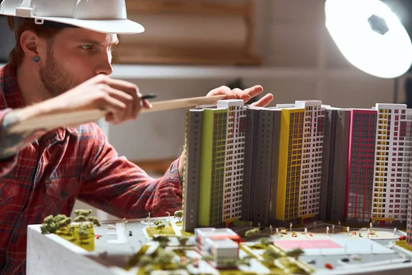 ambitious man creates a complete model of a building