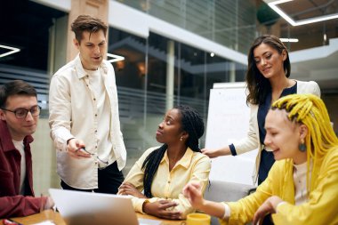 cheerful active young people watching video lesson