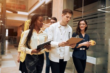 hardworking clever colleague talking in office