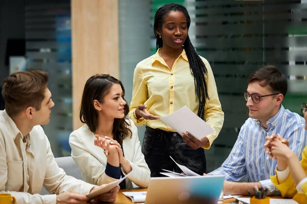 cheerful african girl holding a contact