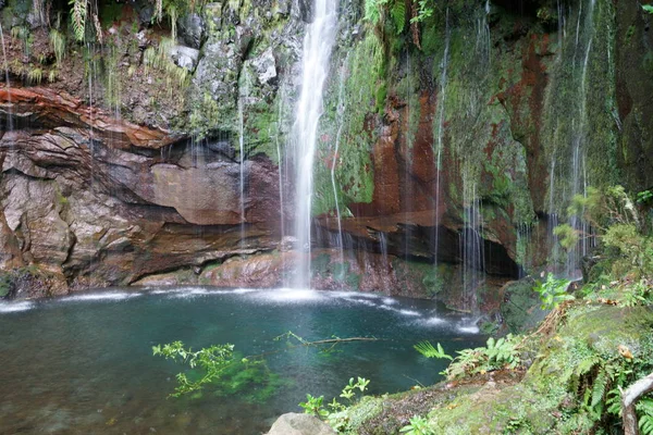 Beautiful waterfall at the end of a levada hike, trekking path, background picture — 스톡 사진