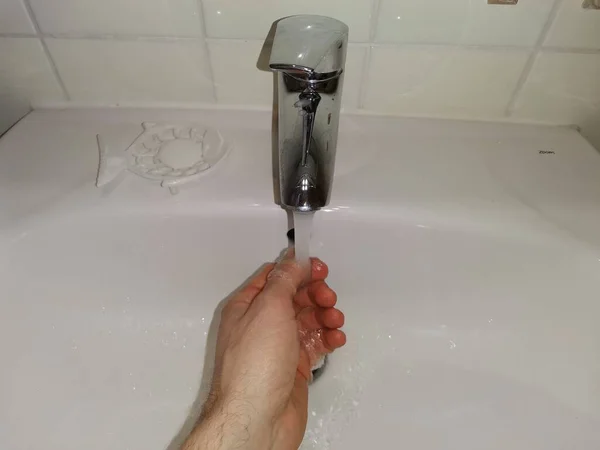 Hygiene concept. Washing single hand with water — Stock Photo, Image