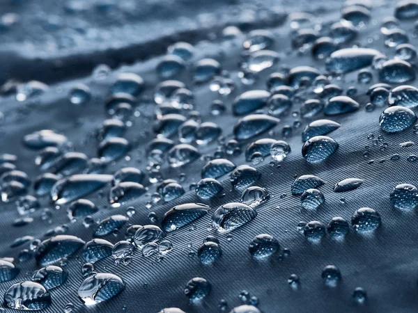 Gotas Água Chuva Tecido Impermeável Fibra Azul Fundo Azul — Fotografia de Stock