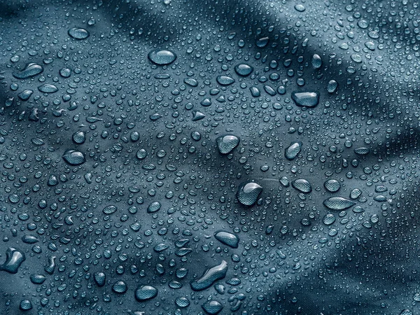 Gotas Agua Lluvia Sobre Tela Impermeable Fibra Azul Fondo Azul —  Fotos de Stock