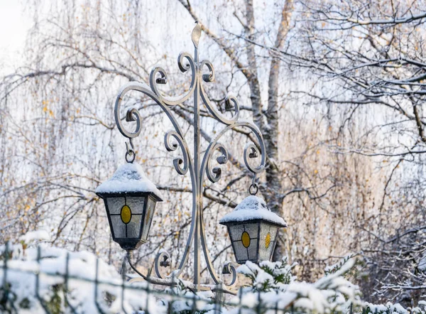 A fragment of a street lamp covered in snow. — Stock Photo, Image