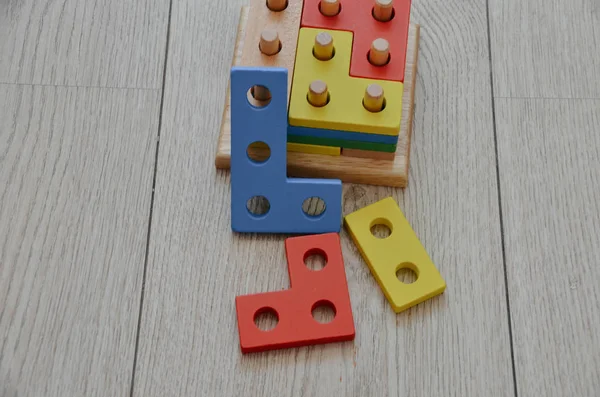 First bright child constructor. Colorful wooden blocks to learn maths isolated