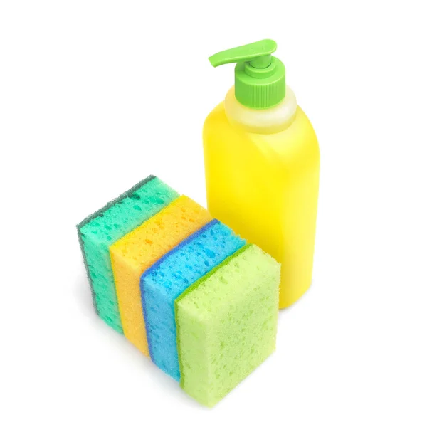 Bright colored sponges and a plastic bottle of liquid for cleaning the bathroom, washing dishes and other household appliances. Isolated. Close-up — Stock Photo, Image