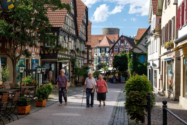 Older Tourists Stroll Streets Small Old German City Image Active Stock Image
