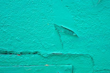 Harap olmuş alçıyla boyanmış parlak, eski bir duvar. Çatlak, çip ve diğer düzensizliklerle dolu pis bir arkaplan.