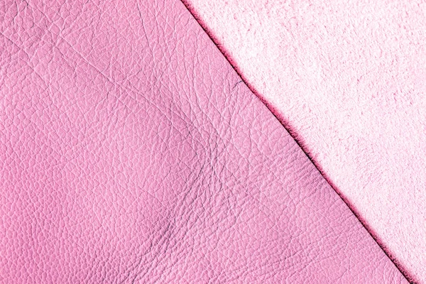 Background of genuine pink pig skin. The front and back sides of the flap. Genuine leather is used for tailoring fashionable comfortable outerwear, shoes and accessories. Copy space.