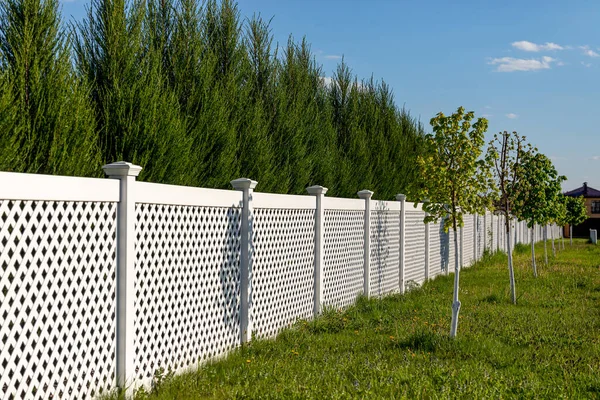 White Vinyl Fence Cottage Village Tall Thuja Bushes Fence Fencing Royalty Free Stock Images