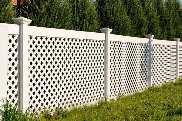 White Vinyl Fence Cottage Village Tall Thuja Bushes Fence Fencing Stock Photo