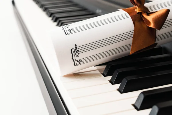 Piano Keyboard and Music Sheet close up. Music Instrument, romance, gift,  concept