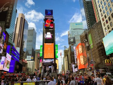New York City/USA - May 24, 2019.  Times Square is an Iconic Street of New York City. Street View, Neon Art, Billboards, Traffic, Street Artists and Tourists.