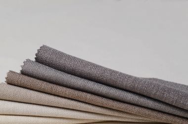 Topçu Tekstil örnekleri parlak topluluğu. Kumaş doku arka plan.