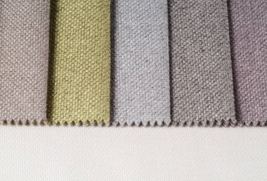 Topçu Tekstil örnekleri parlak topluluğu. Kumaş doku arka plan.