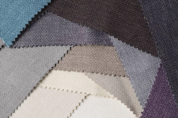 Topçu Tekstil örnekleri parlak topluluğu. Kumaş doku arka plan.