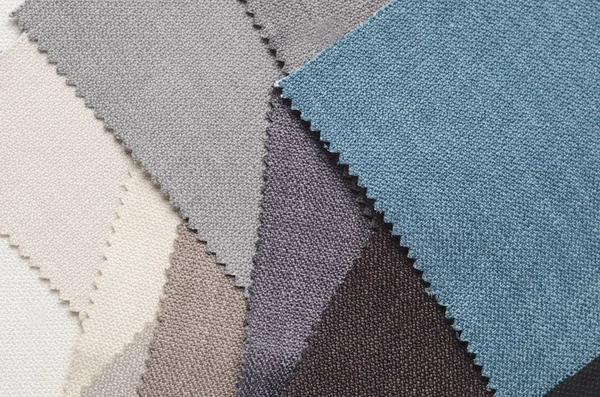 Topçu Tekstil örnekleri parlak topluluğu. Kumaş doku arka plan.