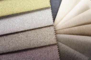 Topçu Tekstil örnekleri parlak topluluğu. Kumaş doku arka plan.