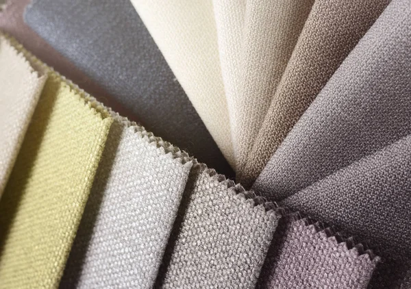 Topçu Tekstil örnekleri parlak topluluğu. Kumaş doku arka plan.