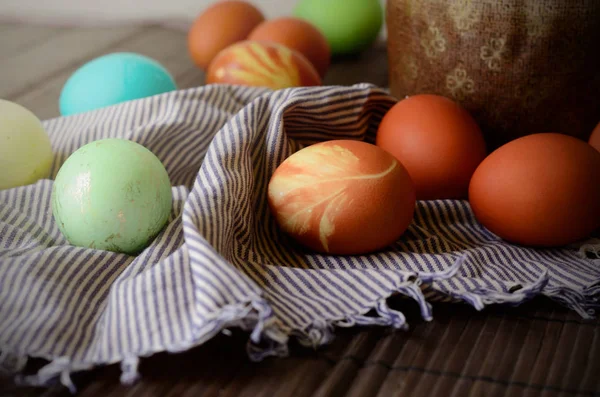 Easter background with traditional colored eggs on a rural table. Hipster style background for orthodox and catholic holiday — Stock Photo, Image