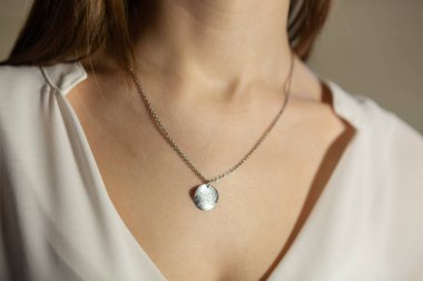 Portrait of beautiful fair young woman with jewelry, one light source