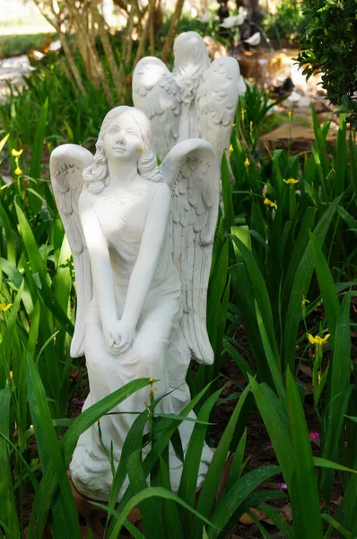 White  statue of angel in the garden, Thailand.