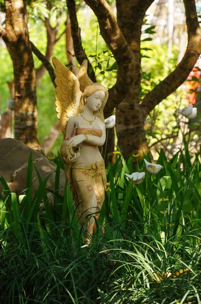 Statue of Thai angel in the garden, Thailand.