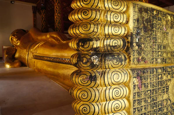 Feet of Reclining Buddha  statue in Wat Pong Sanuk Tai Temple,Th