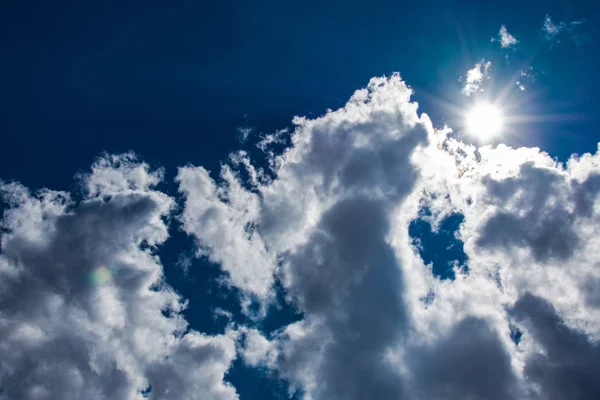 Clouds and blue sky and sun in spring