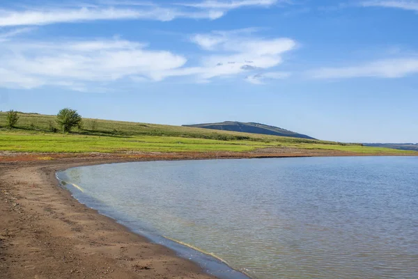 Bay on the Siberian river Yenisei. Beautiful landscape on a sunny summer day.