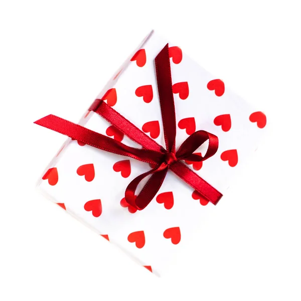 Gift box with hearts and red ribbon — Stock Photo, Image