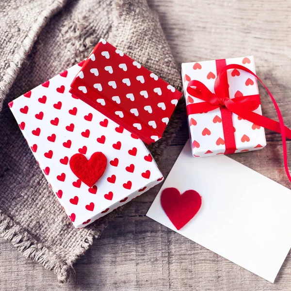 Gift boxes with heart and card — Stock Photo, Image