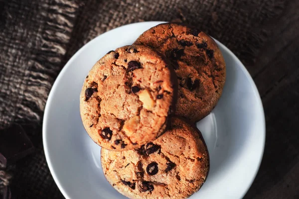 Chocolate chip cookies on white plate — Stock Photo, Image