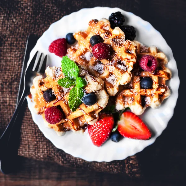 Belgian waffles with mint leaf, strawberries — Stock Photo, Image