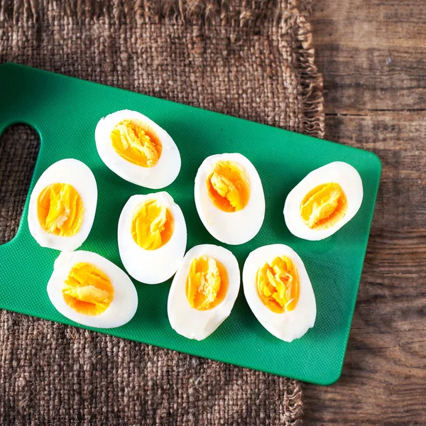 Hard boiled eggs sliced in halves — Stock Photo, Image