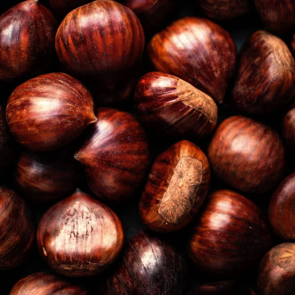 Heap  of edible fresh chestnuts