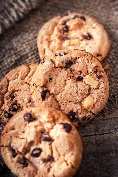 Chocolate chip cookies on sackcloth — Stock Photo, Image