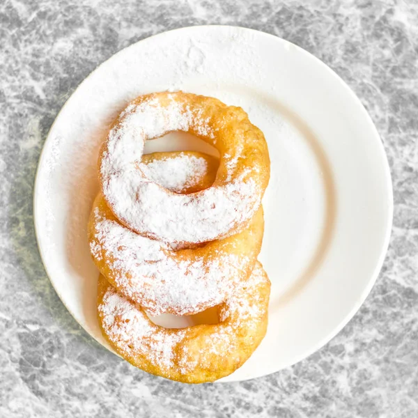 Fresh donuts topped with white sugar — Stock Photo, Image