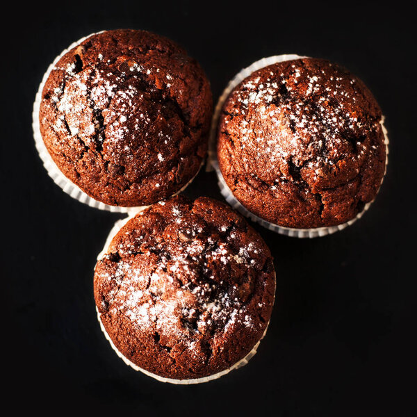 Muffins on dark background
