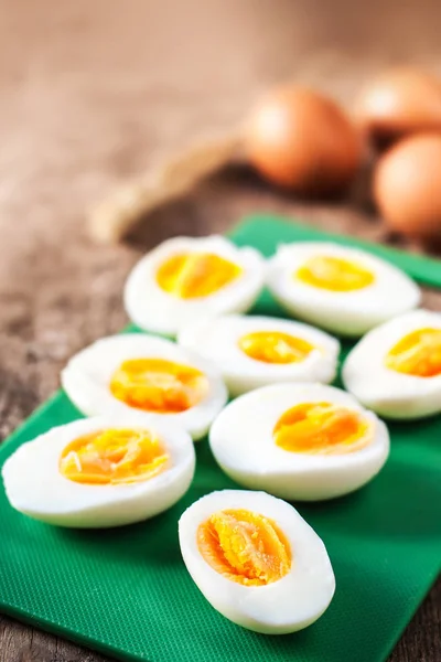 Hard boiled eggs on cutting board — Stock Photo, Image