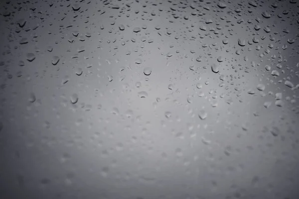 Drops of rain on window glass