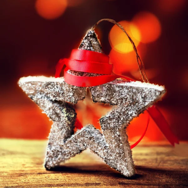 Festive star and red ribbon — Stock Photo, Image