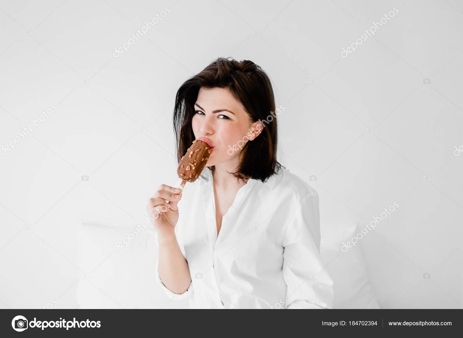 Young Pretty Lady Short Black Hair White Shirt Sits Bed Stock