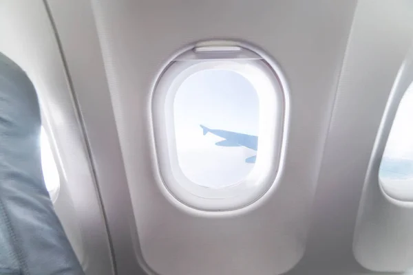 Airplane window view inside an aircraft — Stock Photo, Image