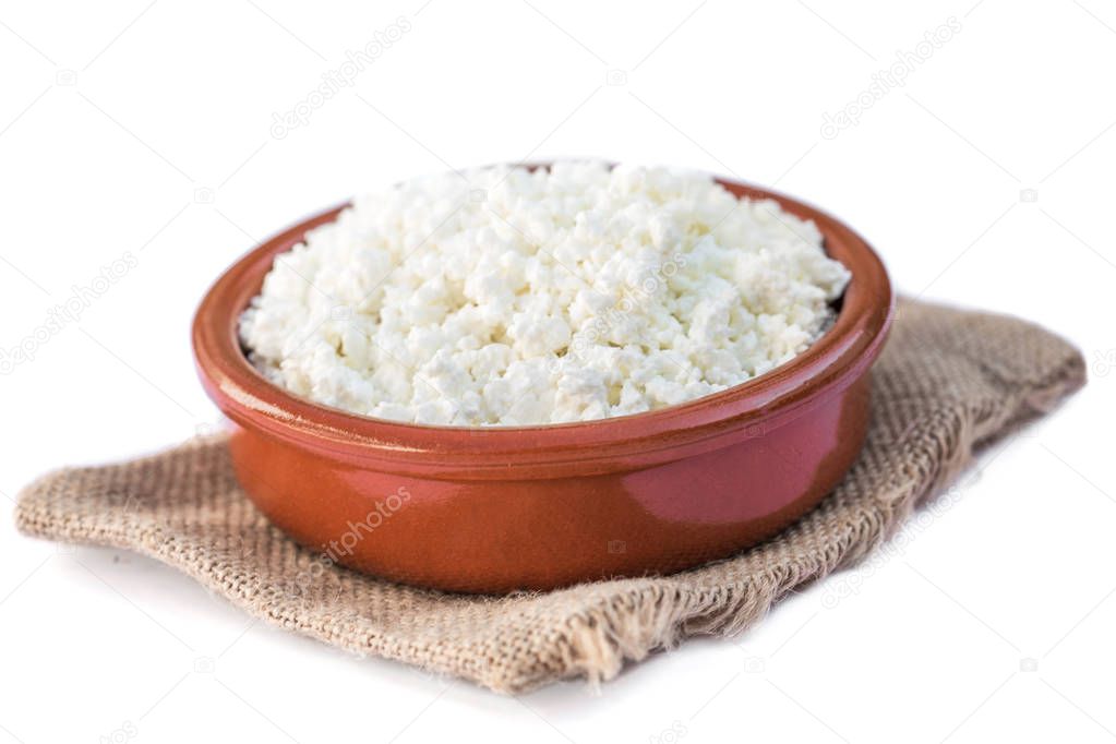 Cottage cheese in a  bowl isolated on a white background
