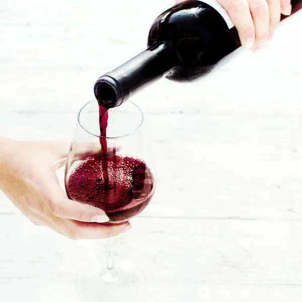 Woman Pouring red  wine