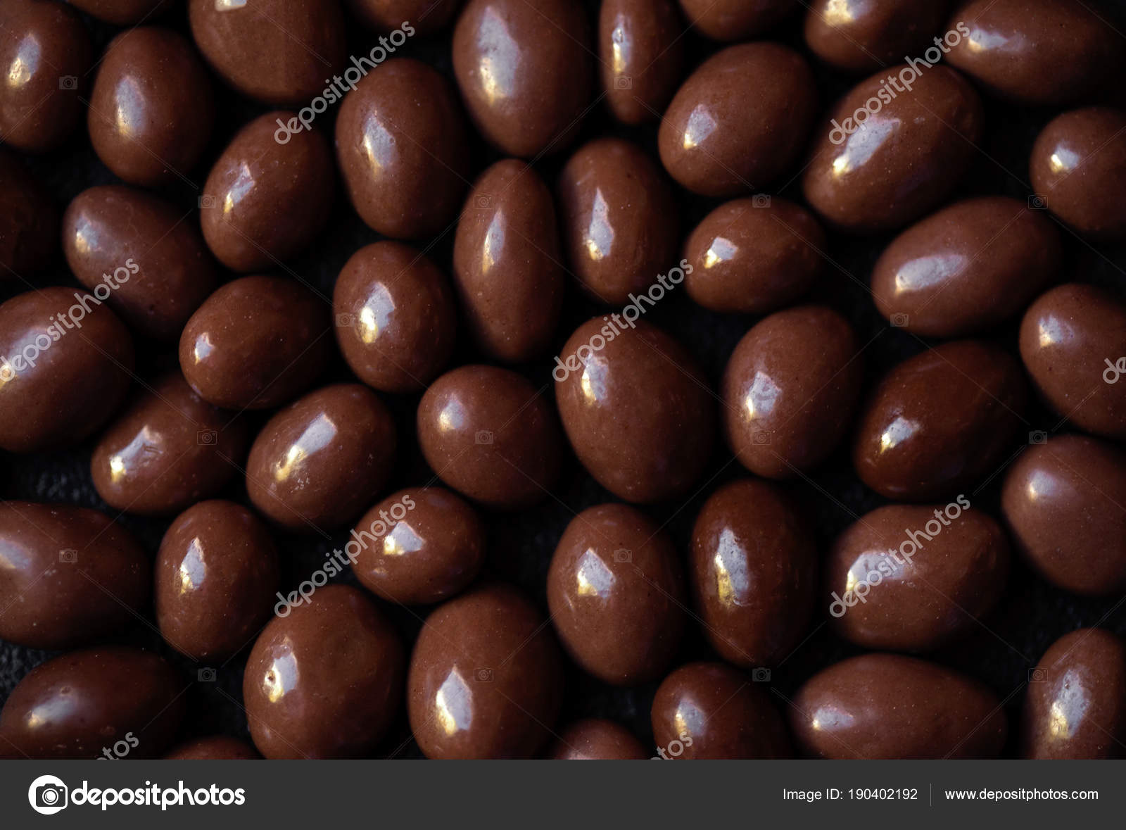 Chocolate candy textured background. Dark brown chocolate round