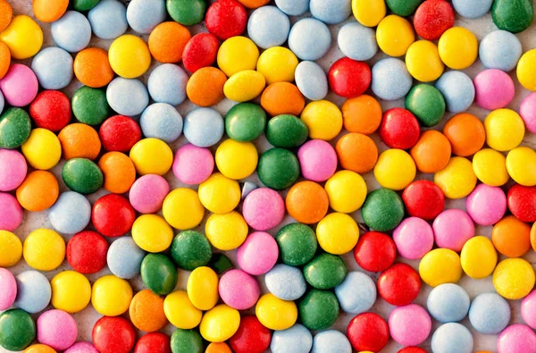Цветные конфеты рисунок фона. Разноцветная мелкоцветная трость — стоковое фото