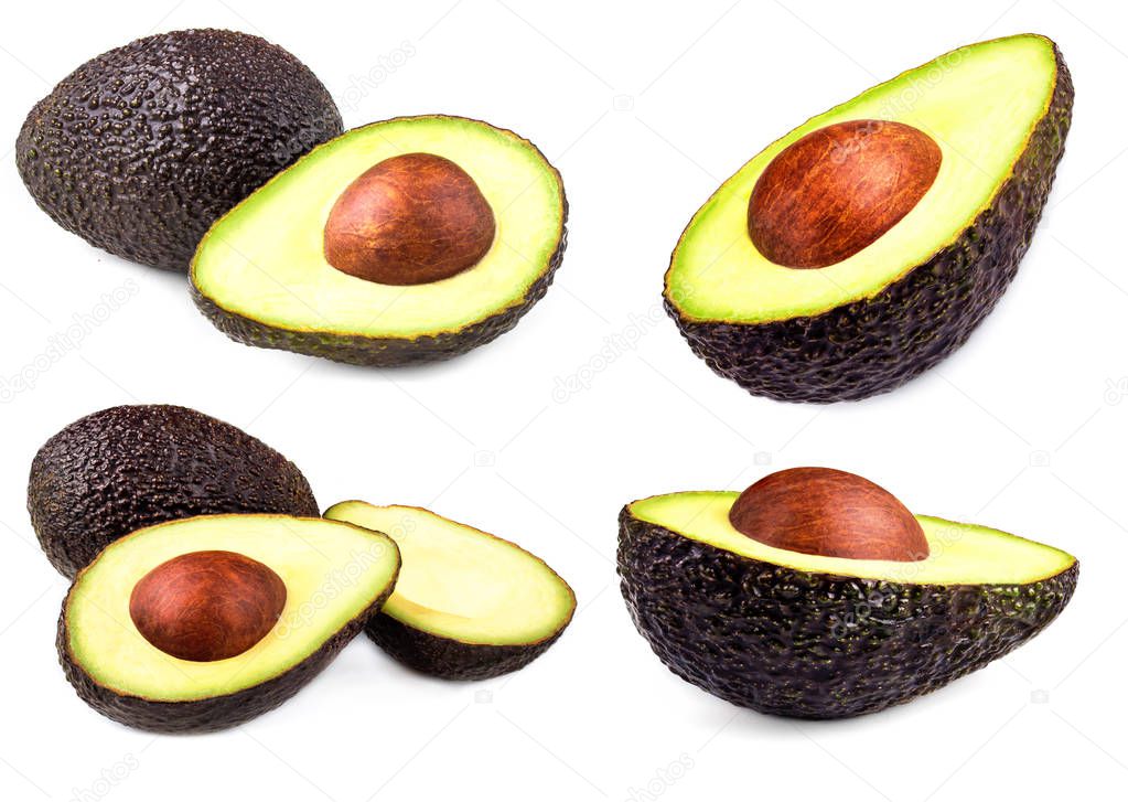 Whole and sliced avocados on black background